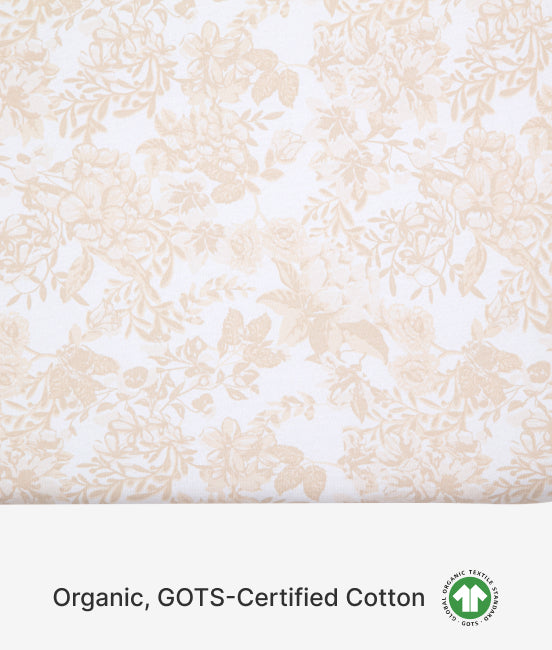 Floral patterned fabric with 'Organic, GOTS-Certified Cotton' text and logo on a white background