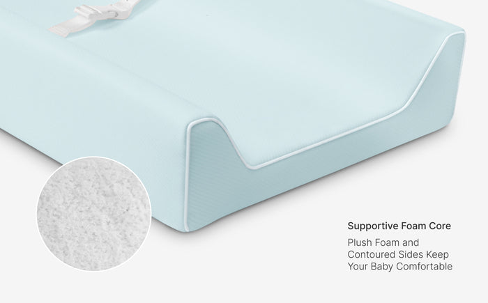Baby crib mattress with supportive foam core and plush texture on a white background