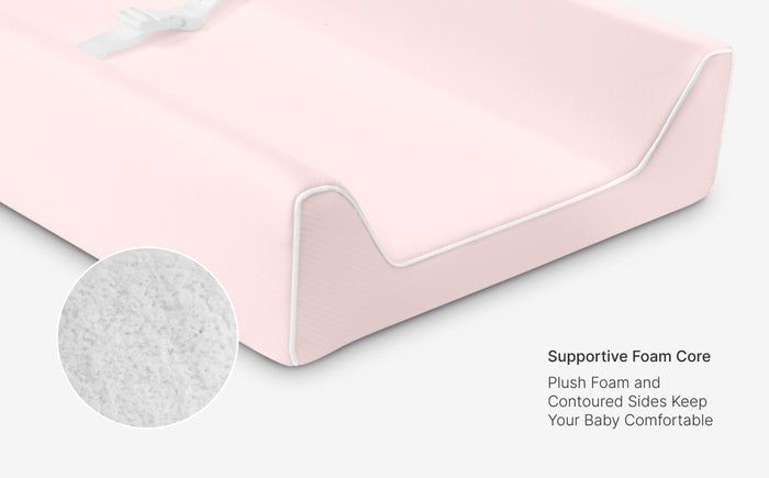 Pink baby pillow with supportive foam core and close-up of foam texture on a white background.