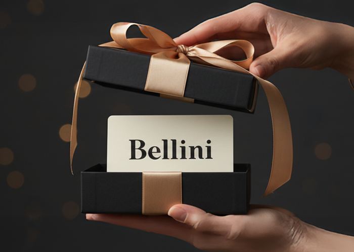 Bellini E-Gift Card - Promotional advertisement for Bellini e-gift cards with a hand holding a gift box on a dark background.