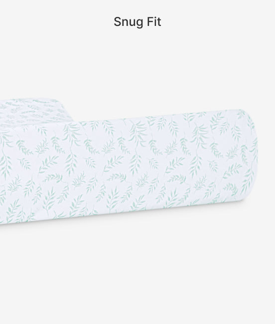 Fitted sheet with subtle leaf pattern on a white background