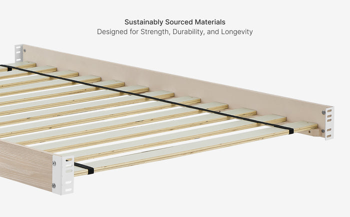 Wooden bed frame with metal slats on a white background, emphasizing sustainability and durability.
