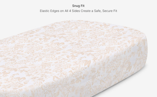 Fitted sheet with textured pattern on a mattress, emphasizing a snug fit.