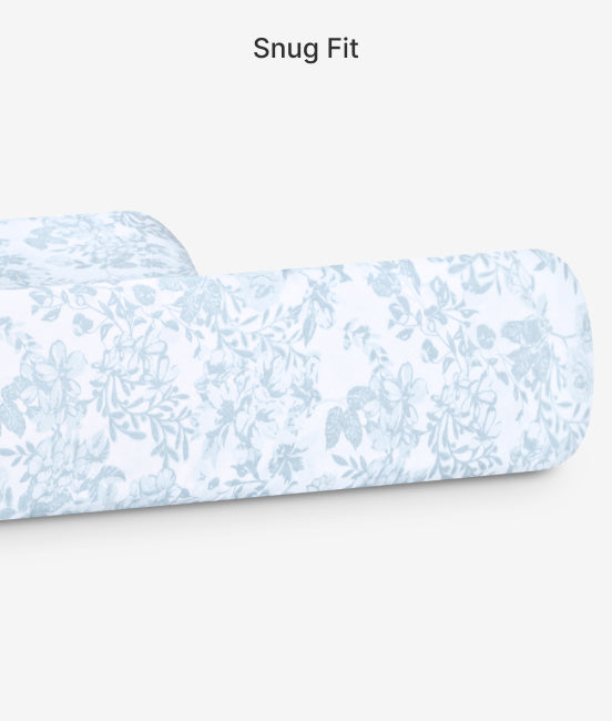 Floral-patterned slipper on a white background with 'Snug Fit' text.