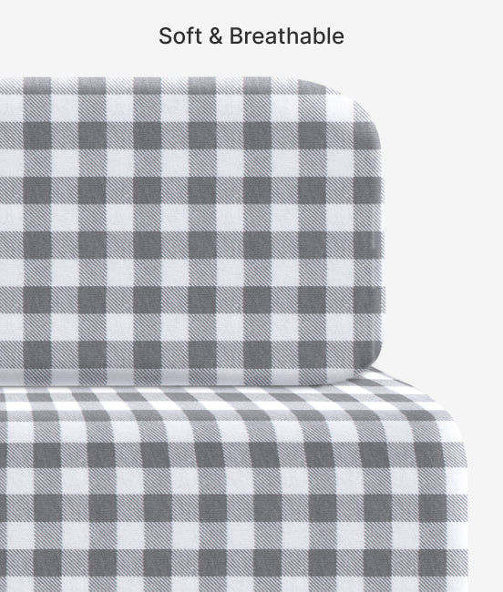 Gray and white checkered fitted sheet on a bed with 'Soft & Breathable' text above.