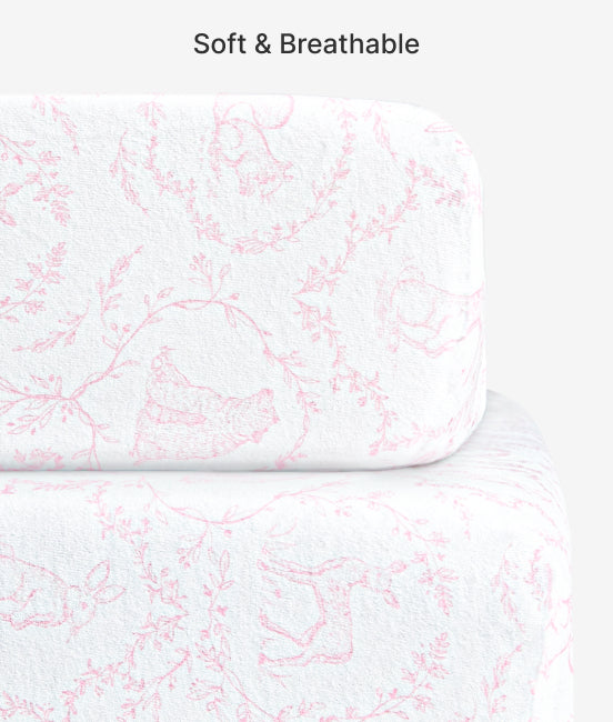 White mattress cover with pink floral pattern and text 'Soft & Breathable' on a white background