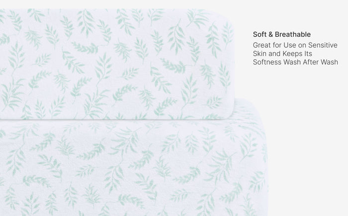 Product packaging with a subtle leaf pattern on a light blue background