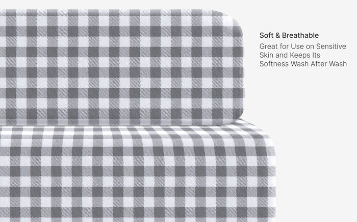 Gray and white checkered fabric on a white background with text about softness and breathability.