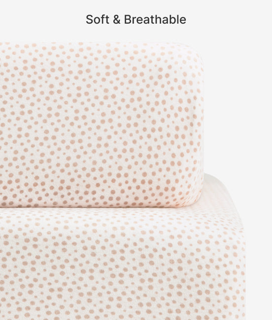 Textured fabric with a subtle pattern on a white background, labeled 'Soft & Breathable'.
