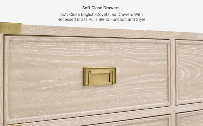 Wooden drawer with gold pull and text about soft close drawers
