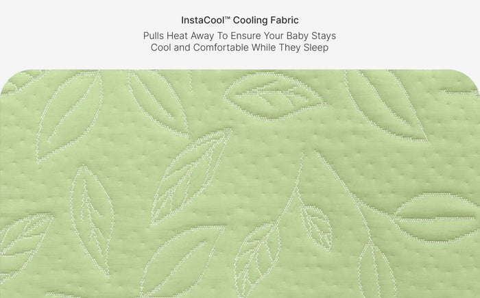 Green cooling fabric with leaf pattern and text about heat regulation for babies.
