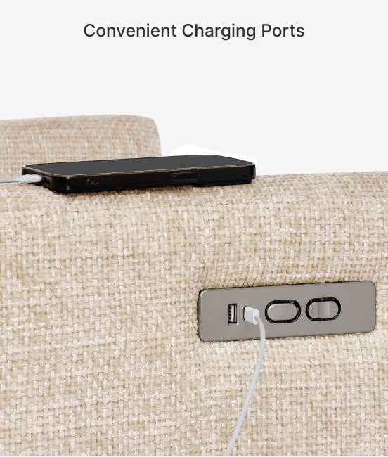Phone charging on a beige sofa with visible charging ports.