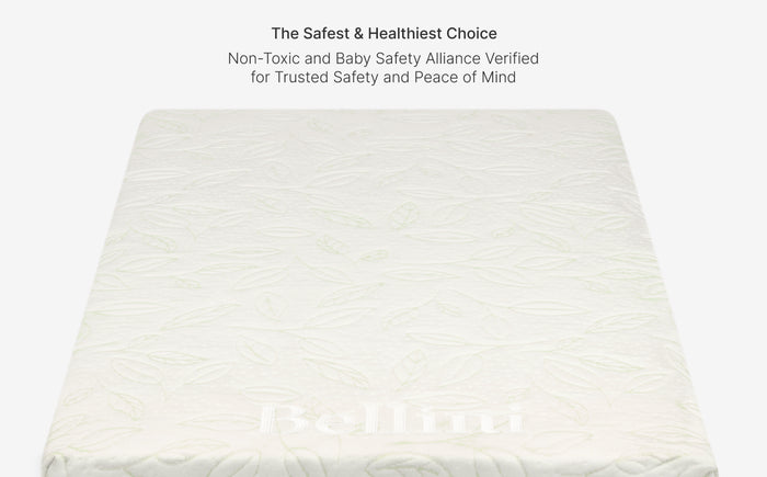 White mattress with 'Babymoov' branding on a light gray background