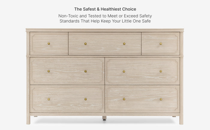 Wooden dresser with gold knobs on a white background