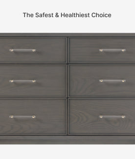 Gray dresser with six drawers and metallic handles on a white background.