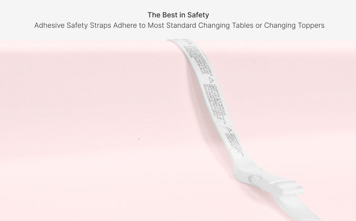 White adhesive safety strap on a pink background with text about its use.