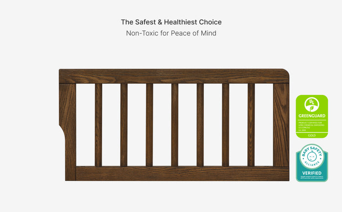 Wooden crib with green label indicating safety and healthiness on a white background