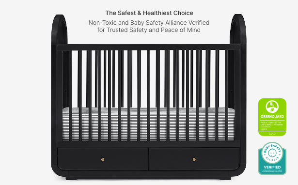 Black crib with safety certification logos on a white background