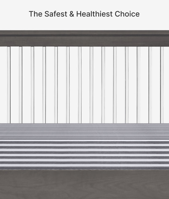 Crib with horizontal bars and text 'The Safest & Healthiest Choice' on a wooden floor.